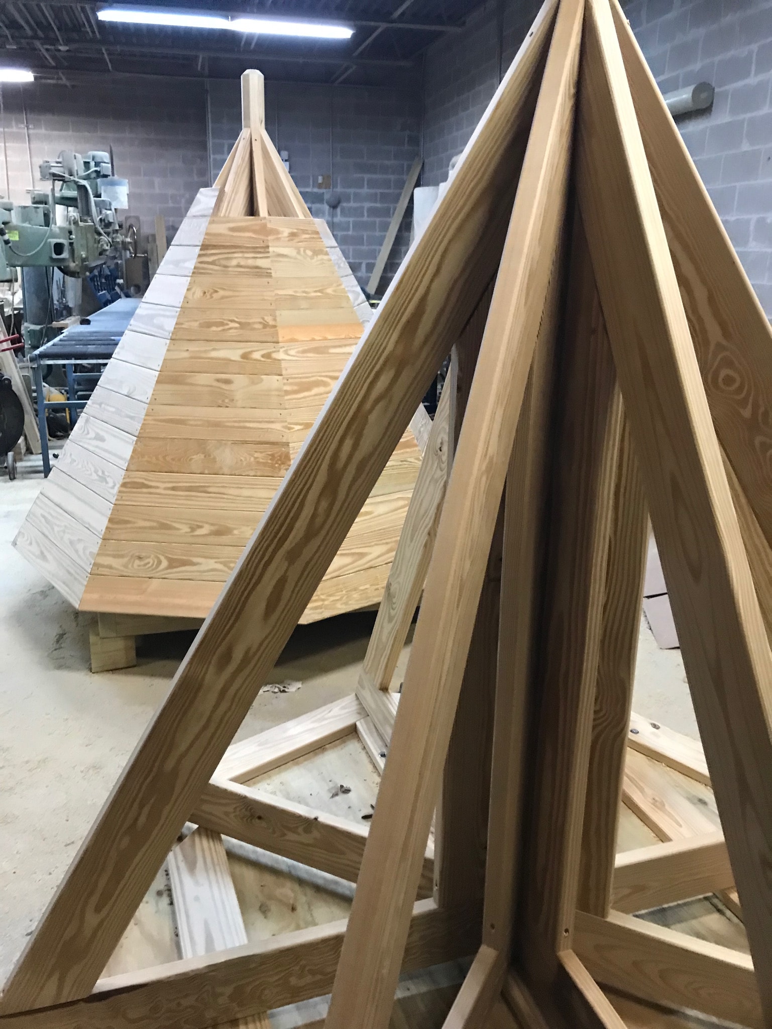 A machined beam saddle cradling a radiused post.
