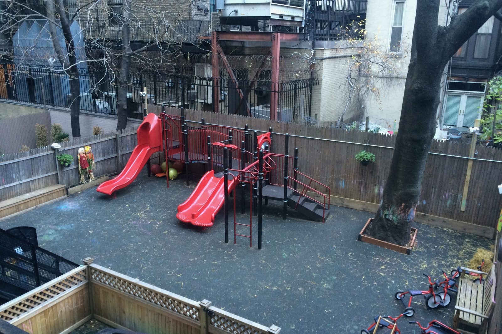 Before: the old red metal playground on rubber surfacing in the school courtyard.