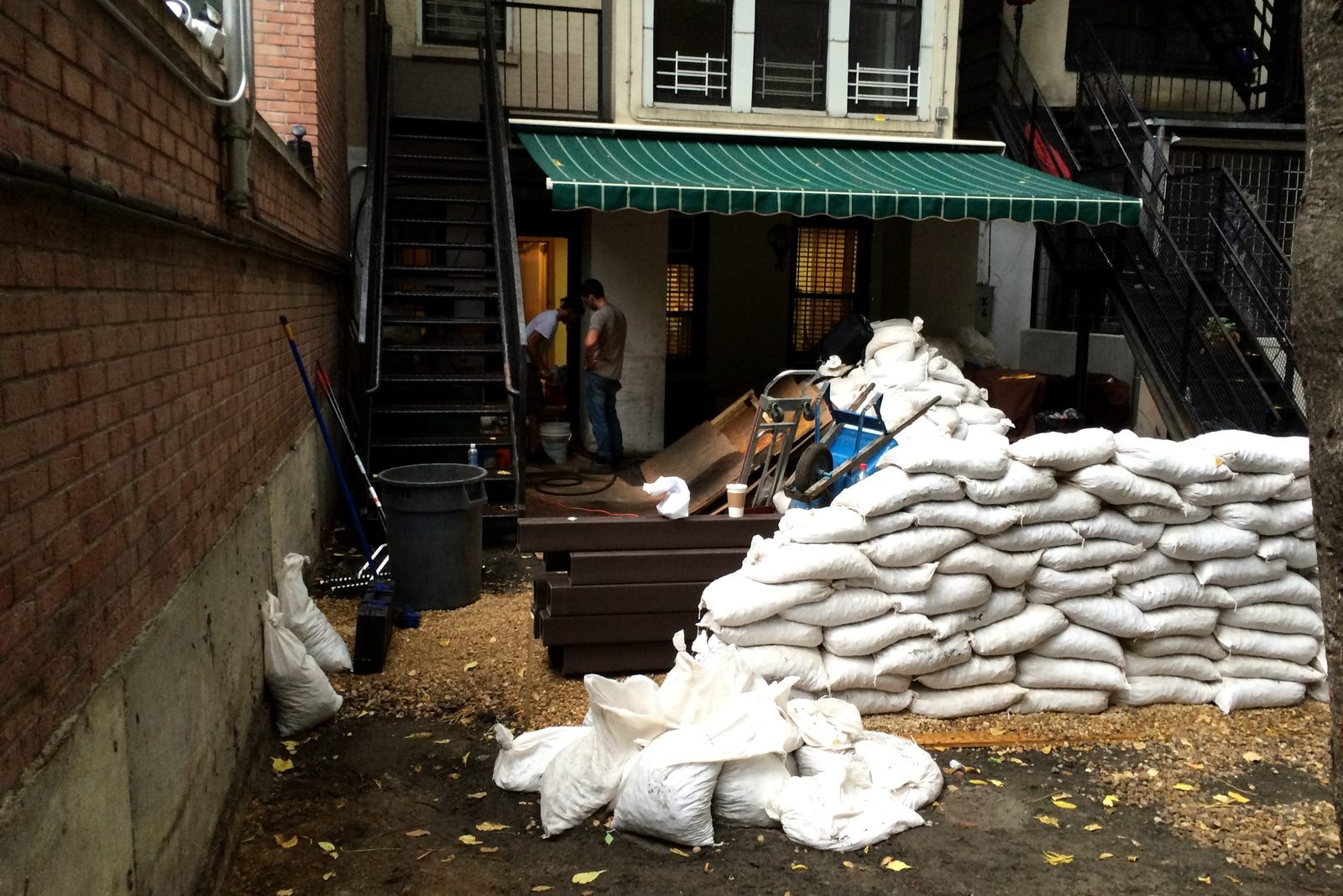 Demolition: the courtyard cleared, with sandbags stacked for removal.
