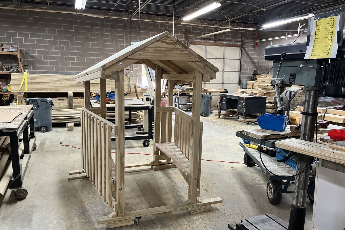 Full prefab wood playhouse frame assembled in the shop.