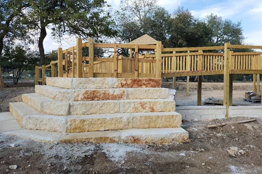 Limestone steps rising to the deck and ramp