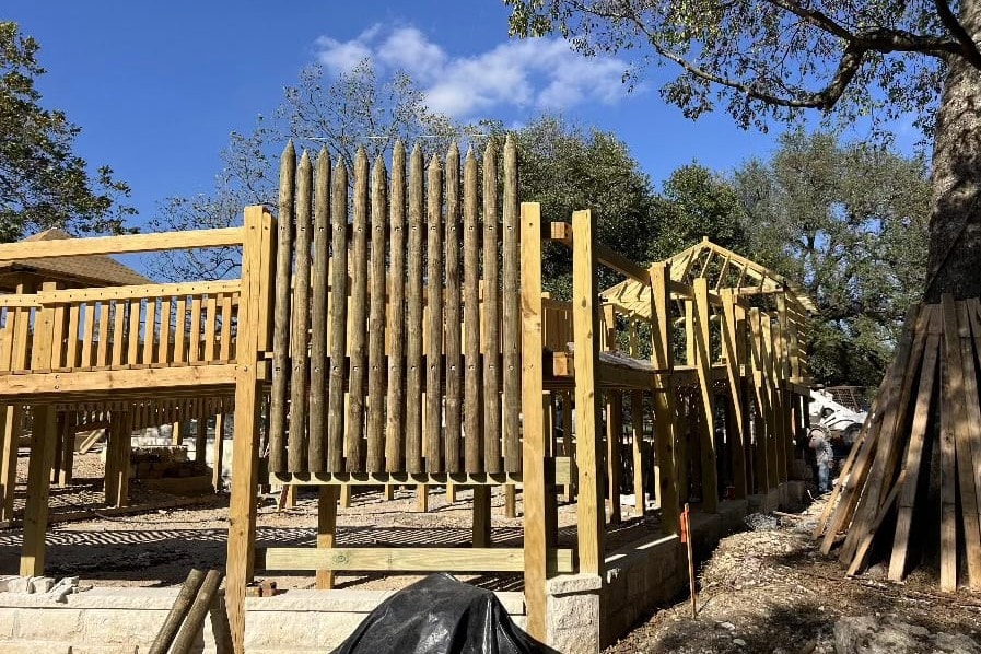Log palisade wall taking shape