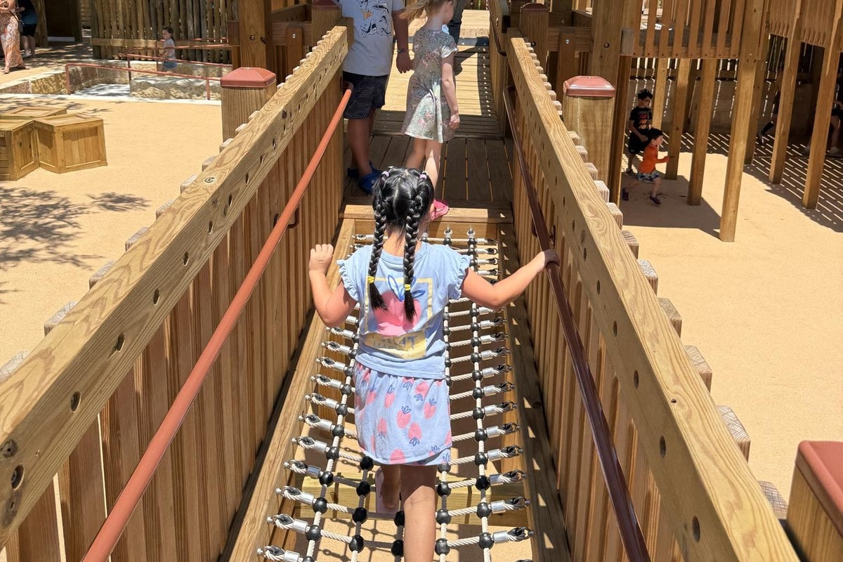 A child crossing the net bridge